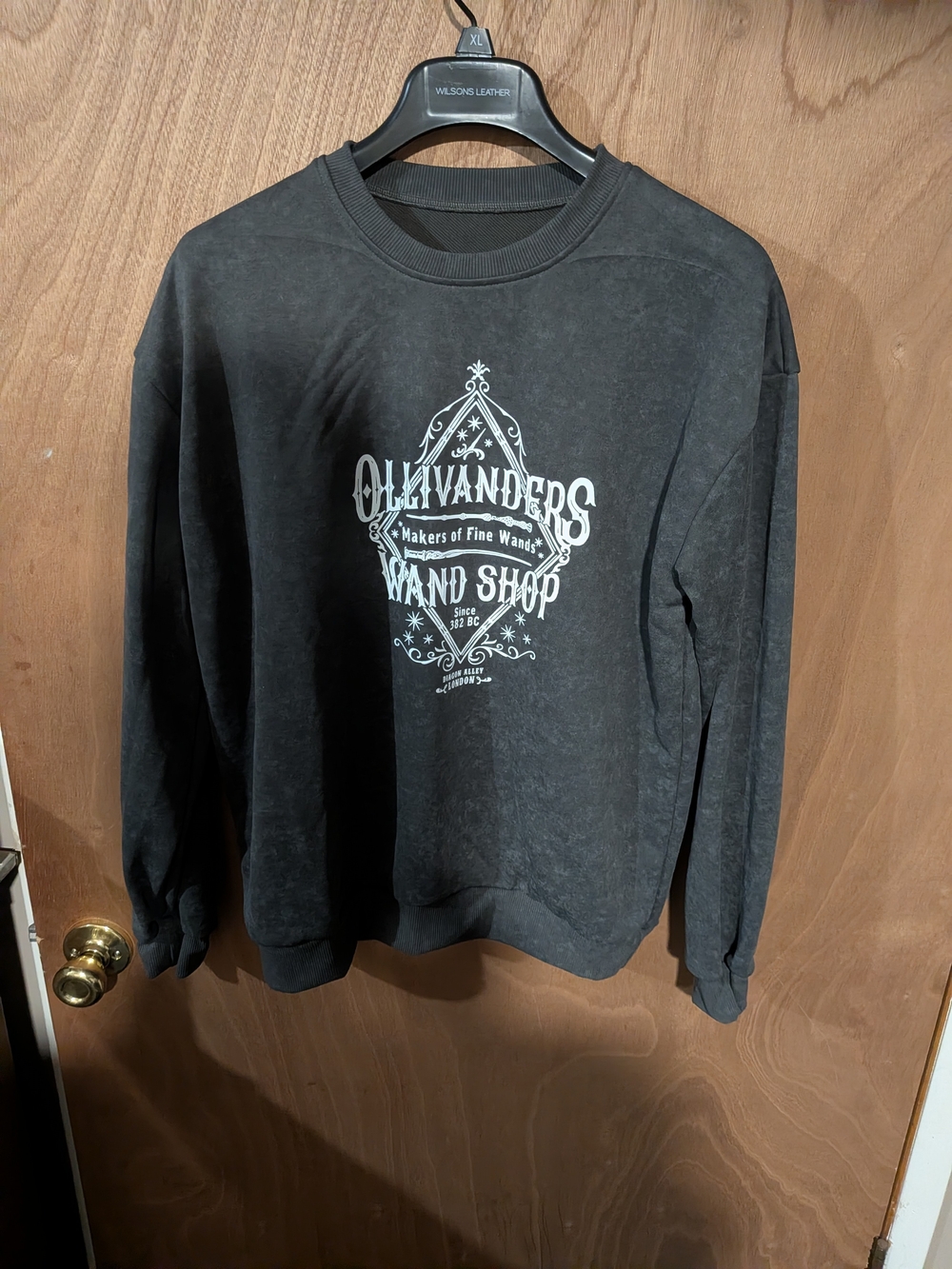 Wilsons Leather Black Crewneck Sweatshirt with White Graphic